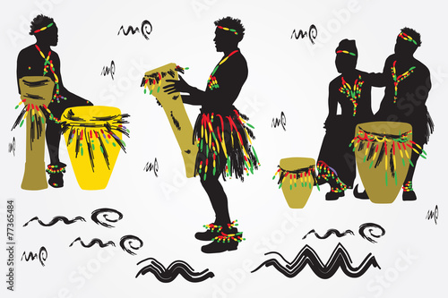 African Musicians dance and play the drums.