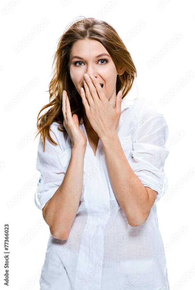 Surprised happy young woman puts her hands over her mouth Surprised happy young woman puts her hands over her mouth