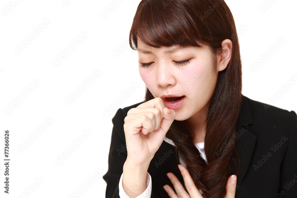 咳をするビジネスウーマン