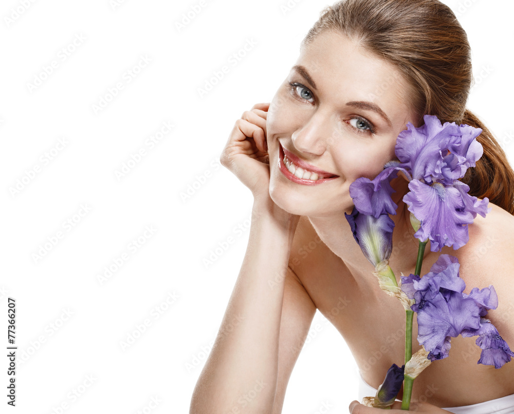Young beautiful smiling woman with blue flower