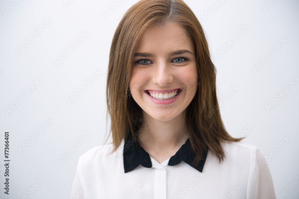 Portrait of a young happy businesswoman over gray background Portrait of a young happy businesswoman over gray background