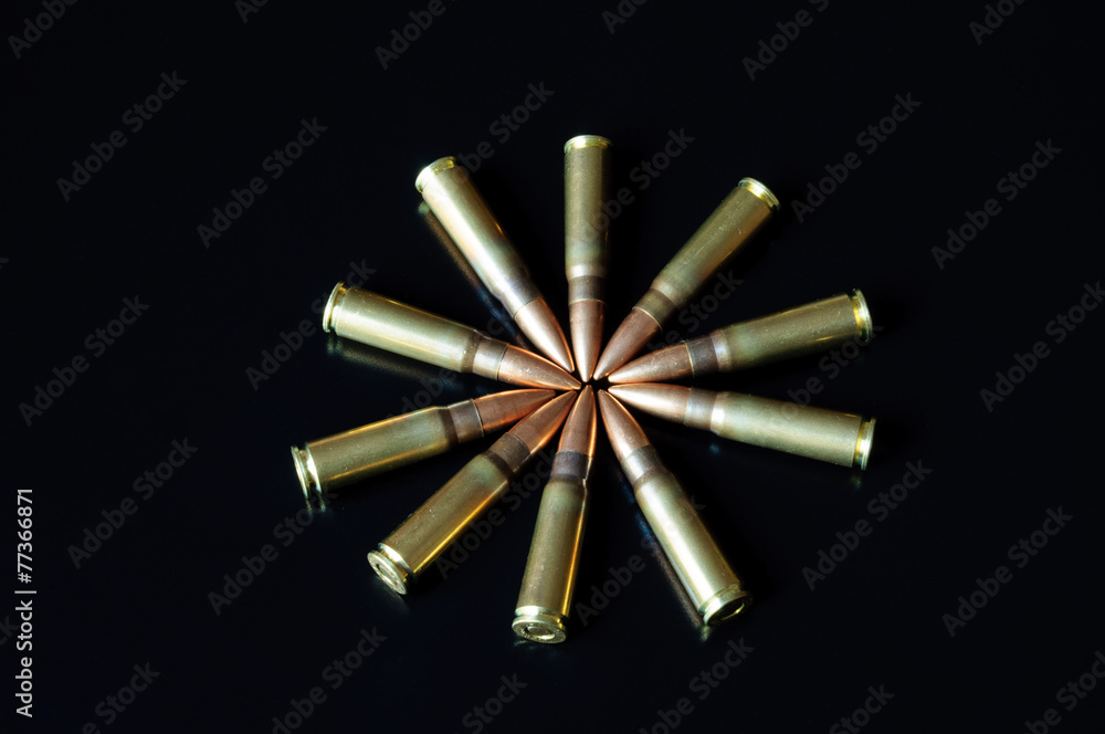 Kalashnikov bullets on the table. Kalashnikov bullets on the table.