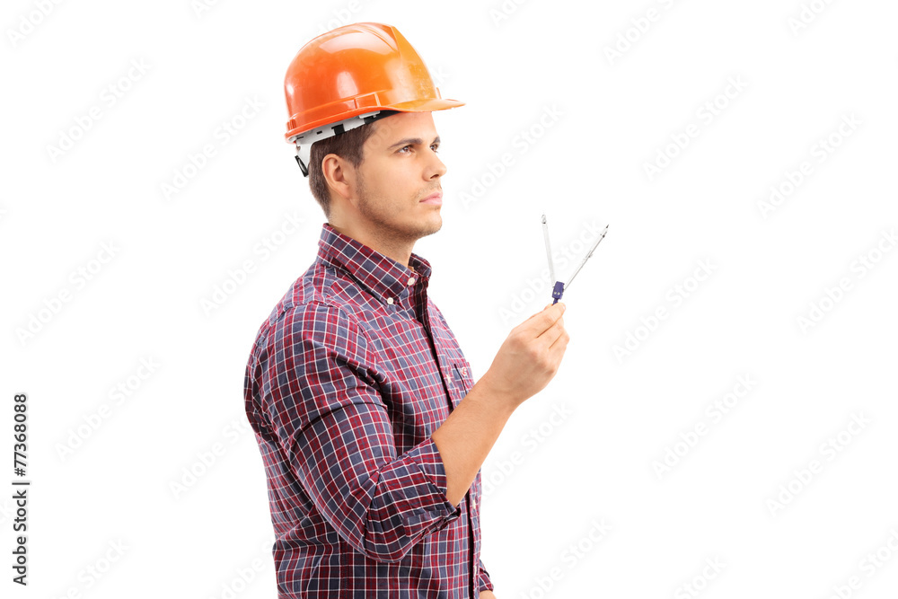 Male architect holding a drawing compass