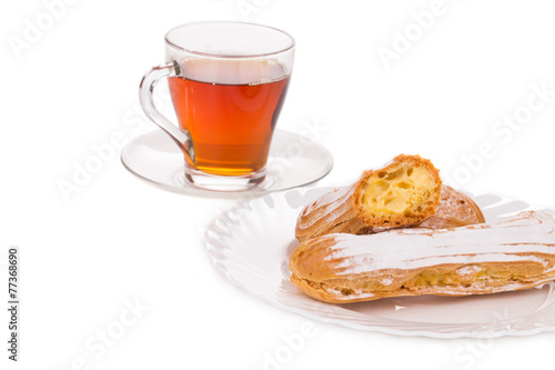 Cup of tea with eclairs