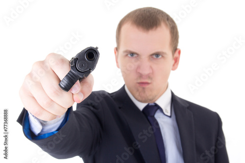 angry man in business suit shooting with gun isolated on white