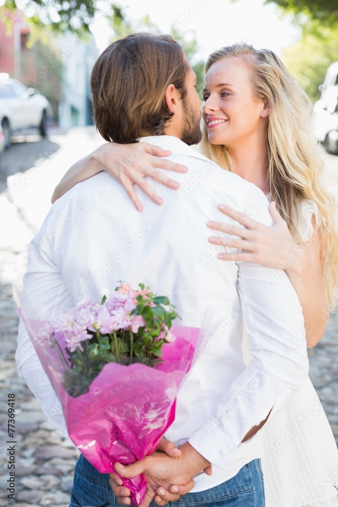 Attractive couple hugging each other