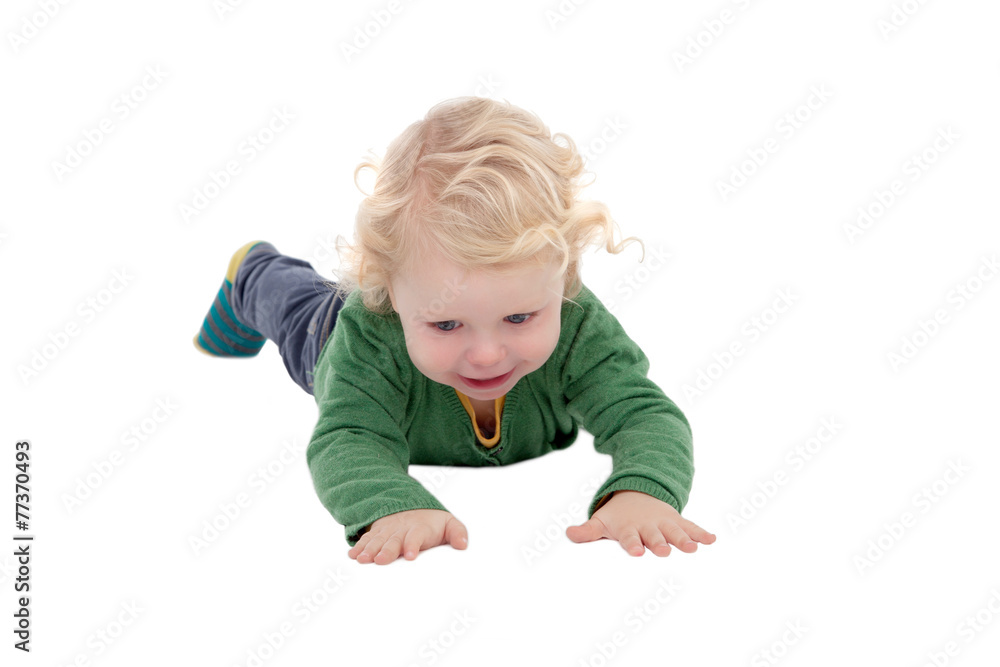 Adorable blond baby lying on the floor