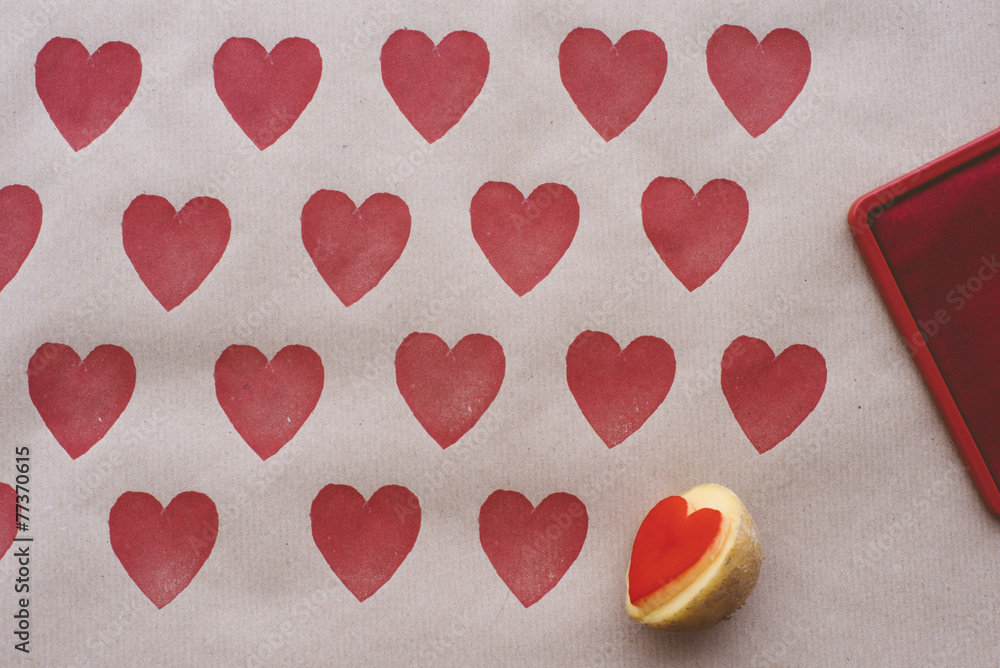 Objects: DIY wrapping paper decorated with heart shaped potato s Objects: DIY wrapping paper decorated with heart shaped potato s