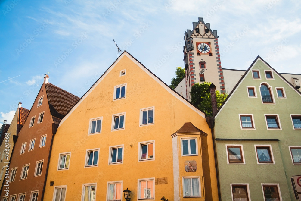 Facades of old buildings and Hohes Schloss in Fussen, Germany