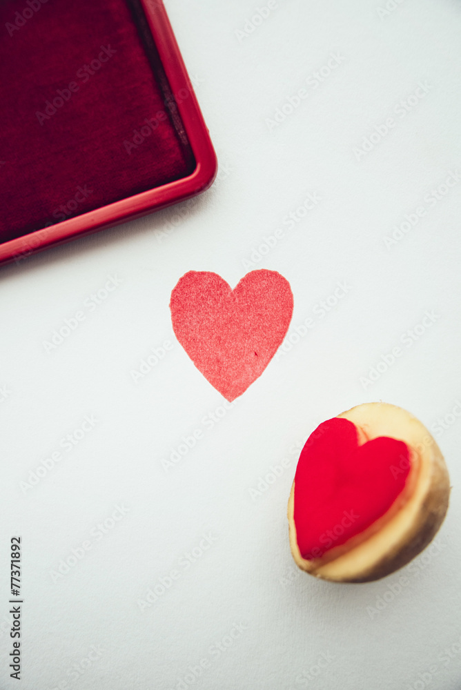 Fototapeta premium Objects: Heart shaped potato stamp on white paper