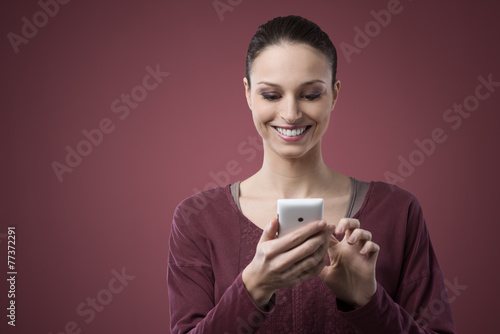 Cheerful woman with mobile phone