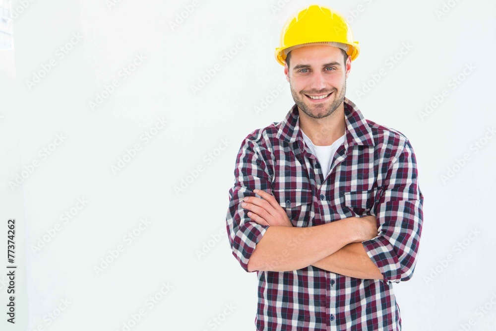 Handome male repairman standing arms crossed