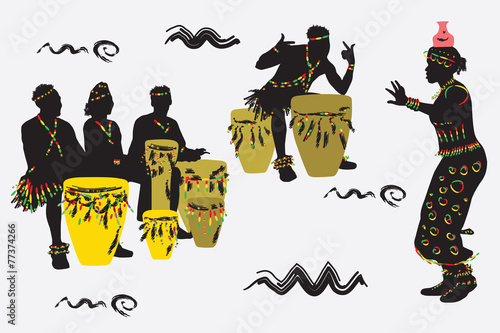 African Musicians dance and play the drums.
