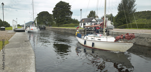 Caledonian canal with sailboats in Scotland