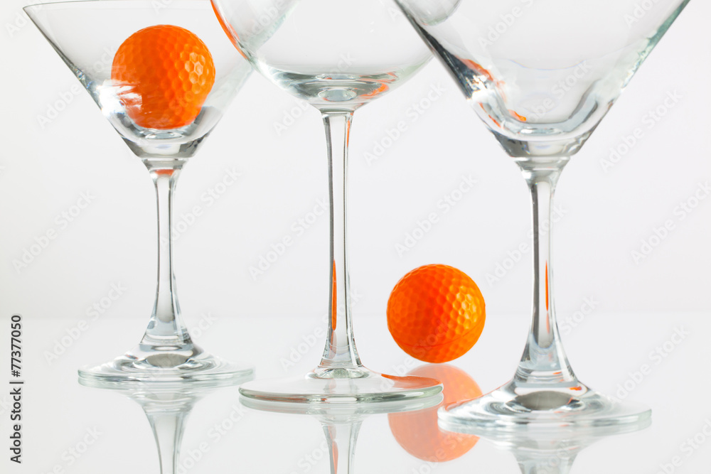 Three glasses of champagne and golf equipments Three glasses of champagne and golf equipments