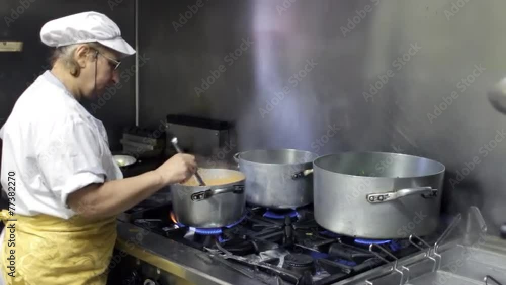 cook cooking in a italian seafood restaurant cook cooking in a italian seafood restaurant