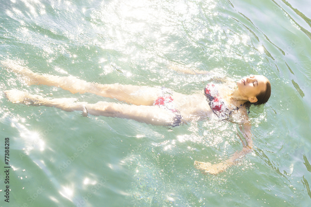 girl swims in the sea