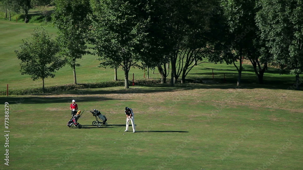 couple on golf course and starts preparing for playing golf couple on golf course and starts preparing for playing golf