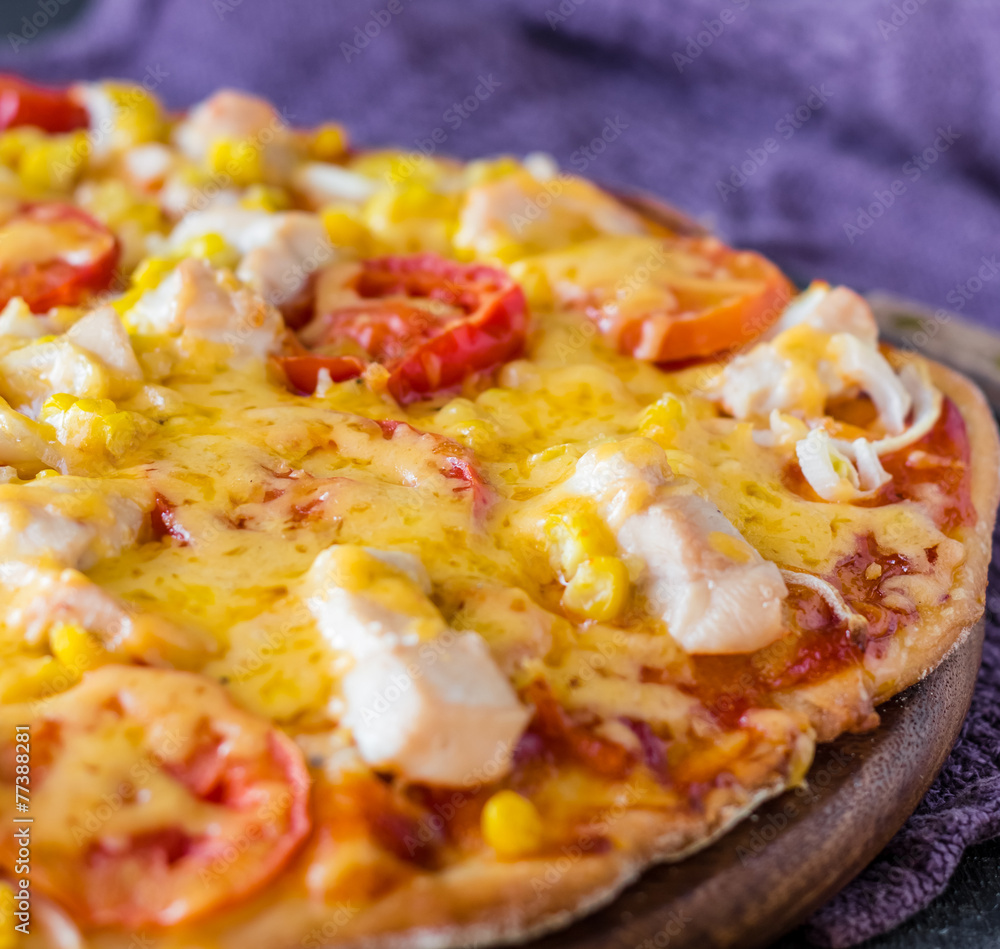pizza with chicken, corn, tomatoes and double cheese pizza with chicken, corn, tomatoes and double cheese