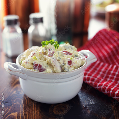 potato salad with parsley garnish photo