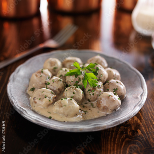 swedish meatballs with parlsey on wooden table photo