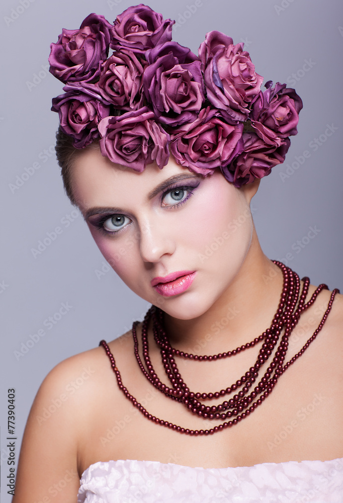 Beautiful young woman with artificial rouses on head necklace an