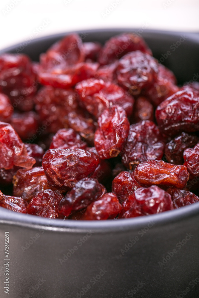 dried cranberries in a bowl ,fruit full of vitamin c. dried cranberries in a bowl ,fruit full of vitamin c.