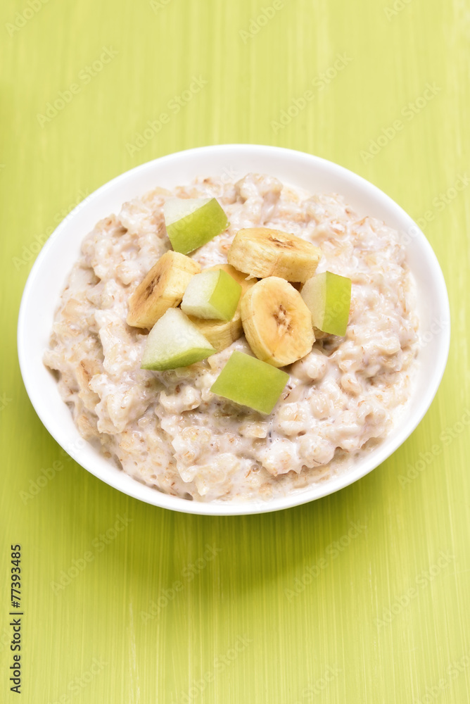 Oatmeal porridge with fruit slices Oatmeal porridge with fruit slices