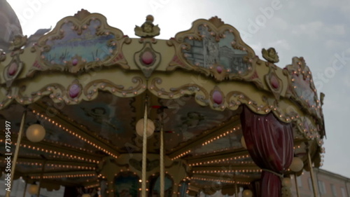 TRIESTE, ITALY - SEP 15, 2013: Close shot of the motley and picturesque top of merry-go-round photo