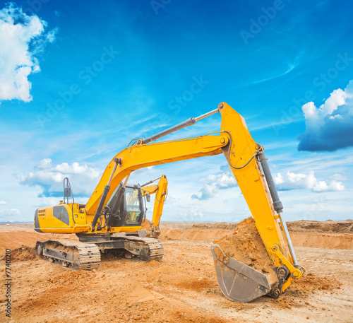 exkavator on construction site and sky background