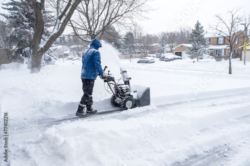 Man Removing Snow With a Snowblower photo