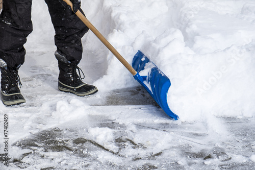 Man Removing Snow from His Driveway