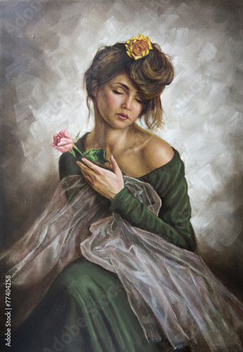 young woman with a flower in her hair and green dress