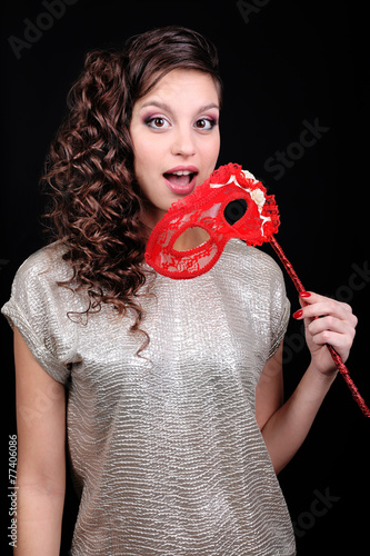 Beautiful girl with masquer...
