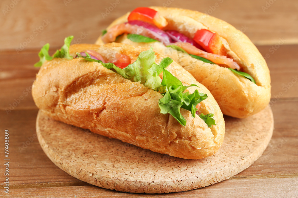 Sandwiches with salmon on wooden background Sandwiches with salmon on wooden background