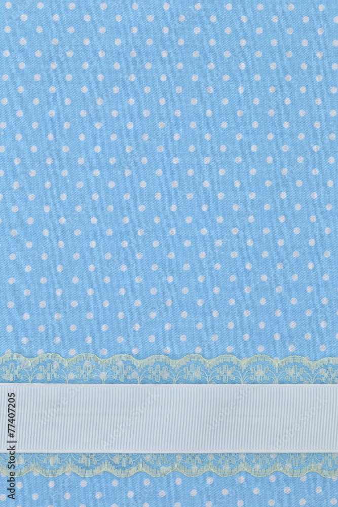Blue retro polka dot textile background with ribbon