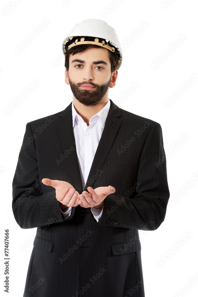 Engineer in protective helmet with cupped hands. Engineer in protective helmet with cupped hands.