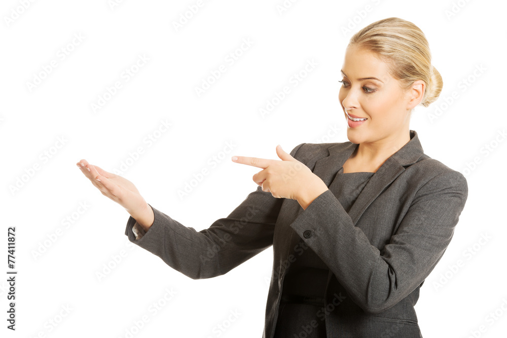 Business woman showing copy space on the left Business woman showing copy space on the left