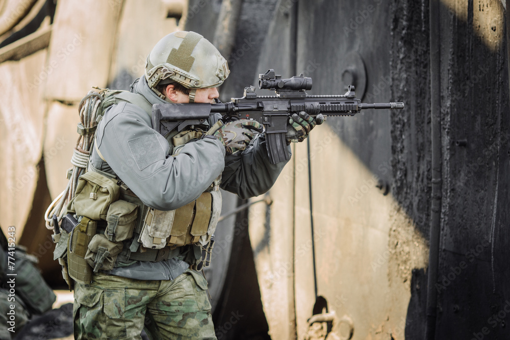 military soldier shooting an assault rifle military soldier shooting an assault rifle