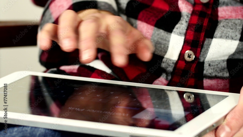 Young girl working on tablet
