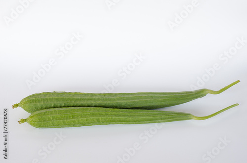 Ridge gourds on white background