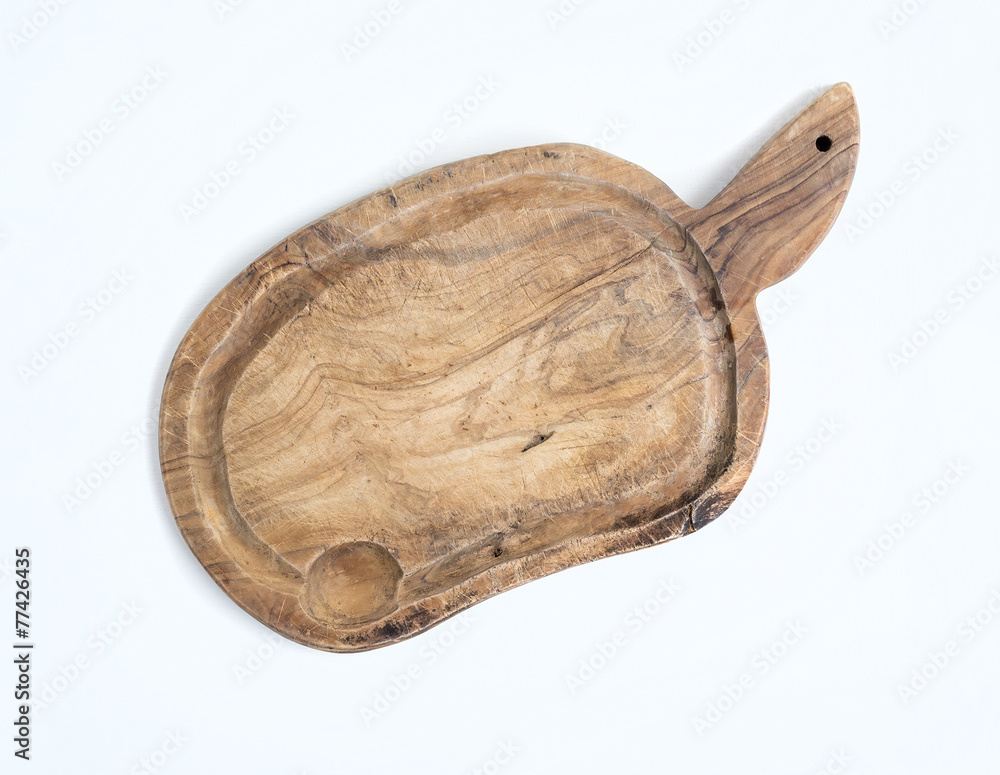 Old rustic cutting board made of olive wood on a white backgroun Old rustic cutting board made of olive wood on a white backgroun
