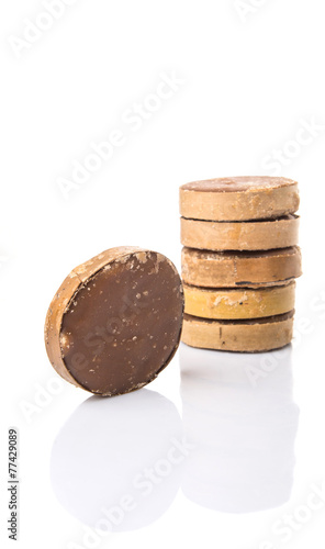 Round palm sugar over white background photo