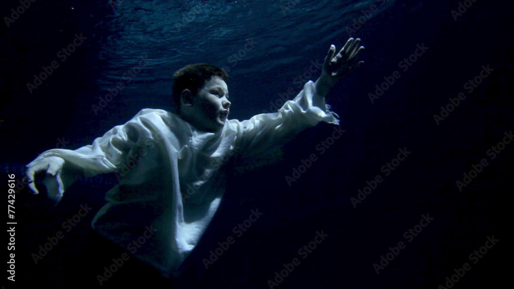 underwater activity and boy swimming under water in clothes underwater activity and boy swimming under water in clothes