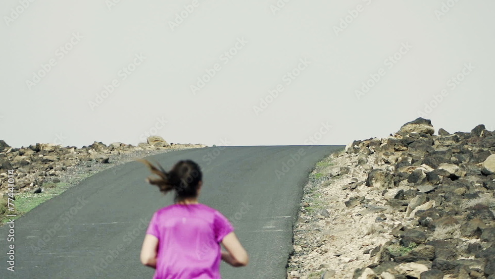 Young people jogging up through road