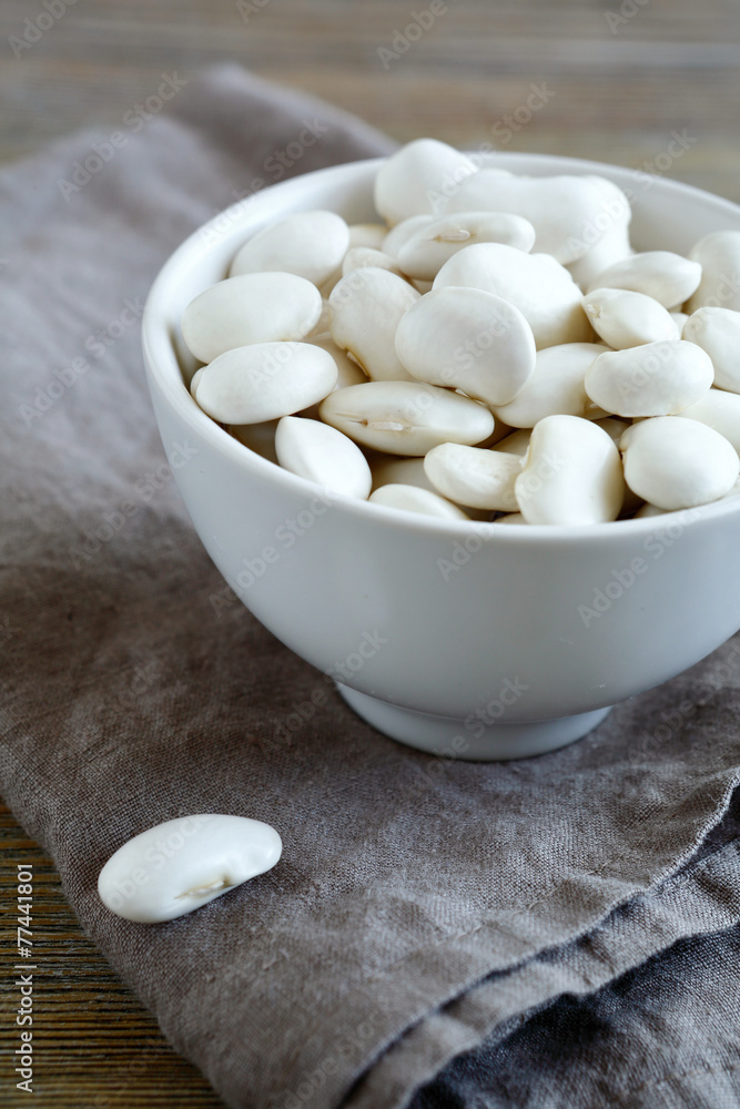 White beans in bowl on a linen napkin White beans in bowl on a linen napkin