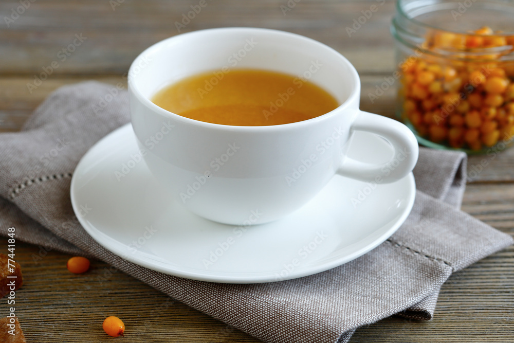 Sea-buckthorn tea in a cup Sea-buckthorn tea in a cup