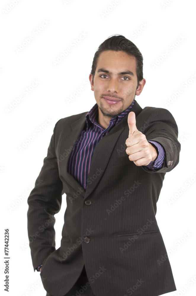 Elegant confident latin man in a suit gesturing victory holding Elegant confident latin man in a suit gesturing victory holding