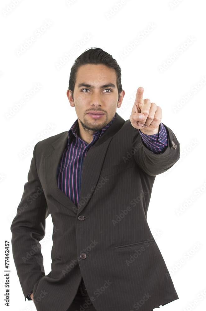 Elegant confident latin man in a suit pointing to the front Elegant confident latin man in a suit pointing to the front