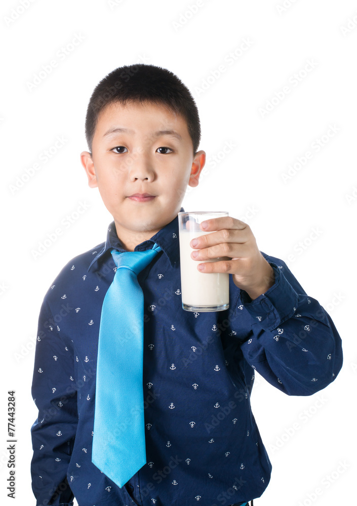Happy boy with glass of milk in hand